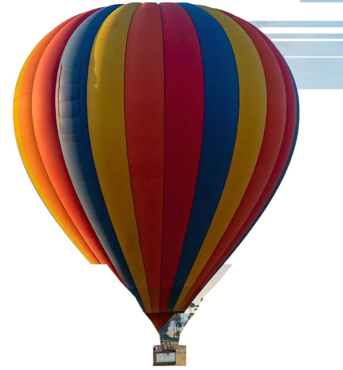 A hot air balloon climbing over the Maasai Mara at first light
