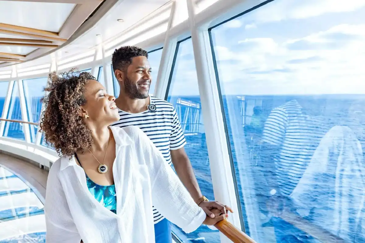 A couple looking out through a ship’s window