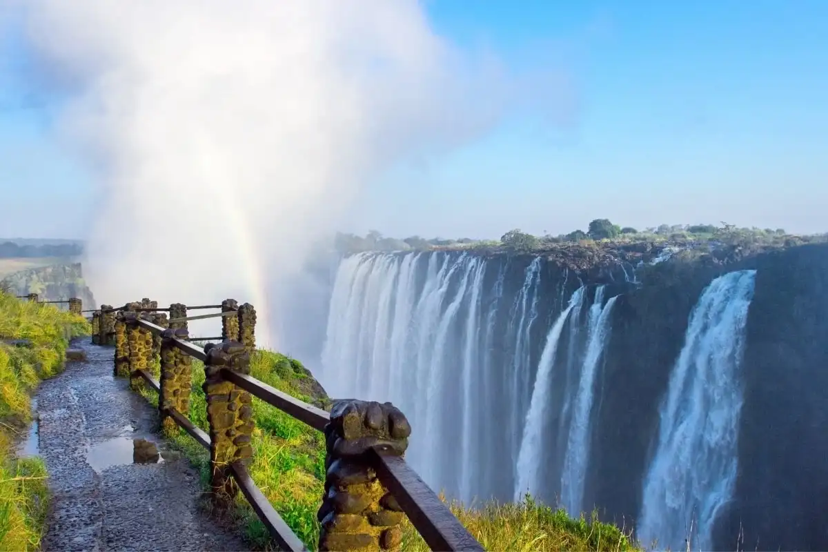 A rainbow over Victoria Falls, seen from the viewing path