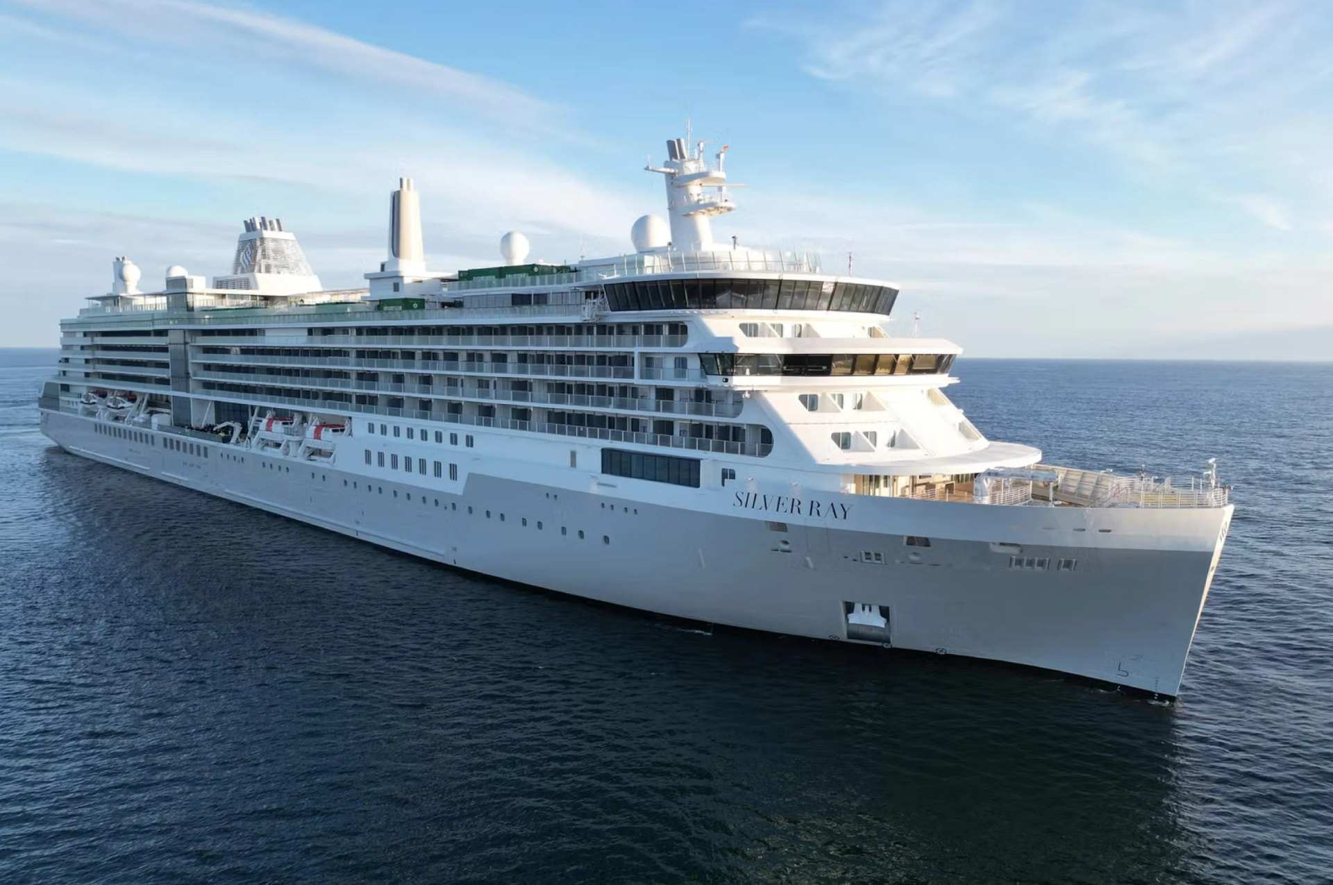 A small white cruise ship at sea